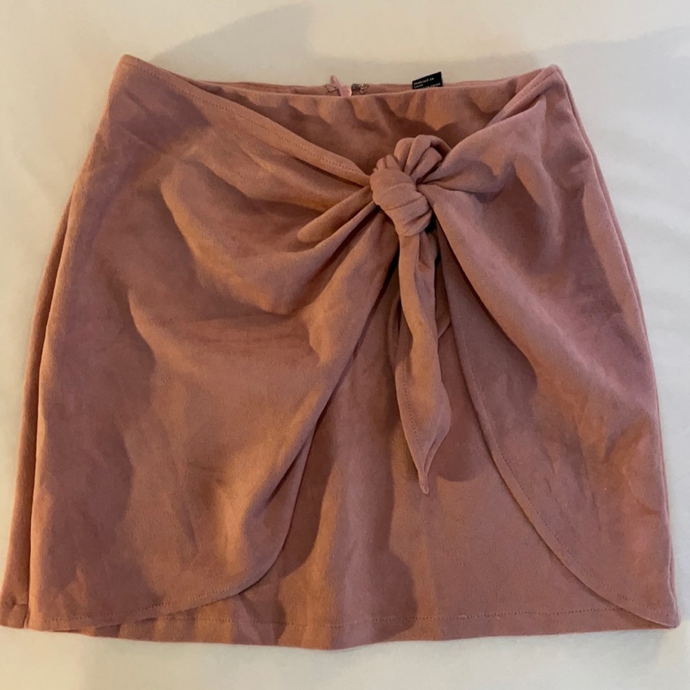 Small pink suede mini skirt